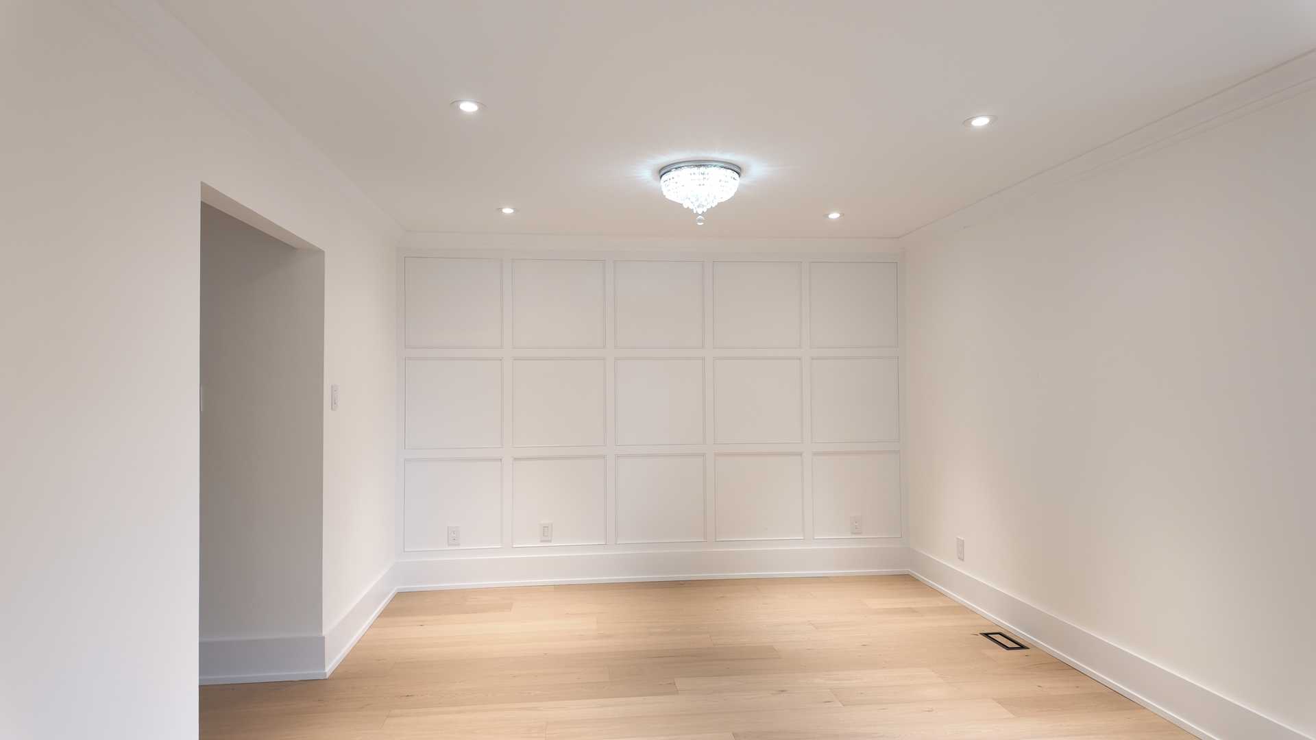 Waffle ceiling matching the square trim wall, brick accent TV