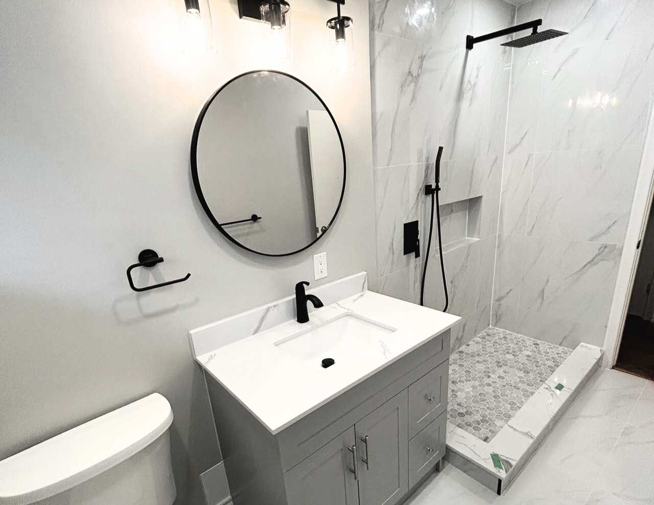 Walkin shower, overhead shower faucet, rounded mirror