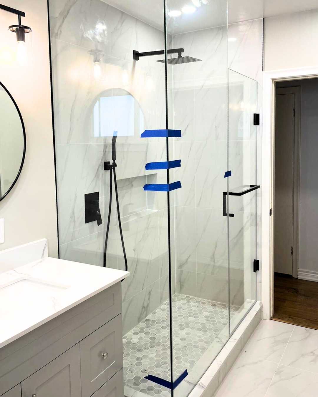 Walkin shower, overhead shower faucet, rounded mirror