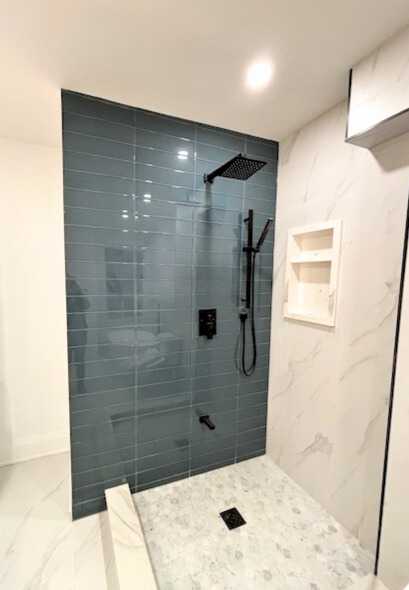 glass subway tile accent shower wall with black fixture *3