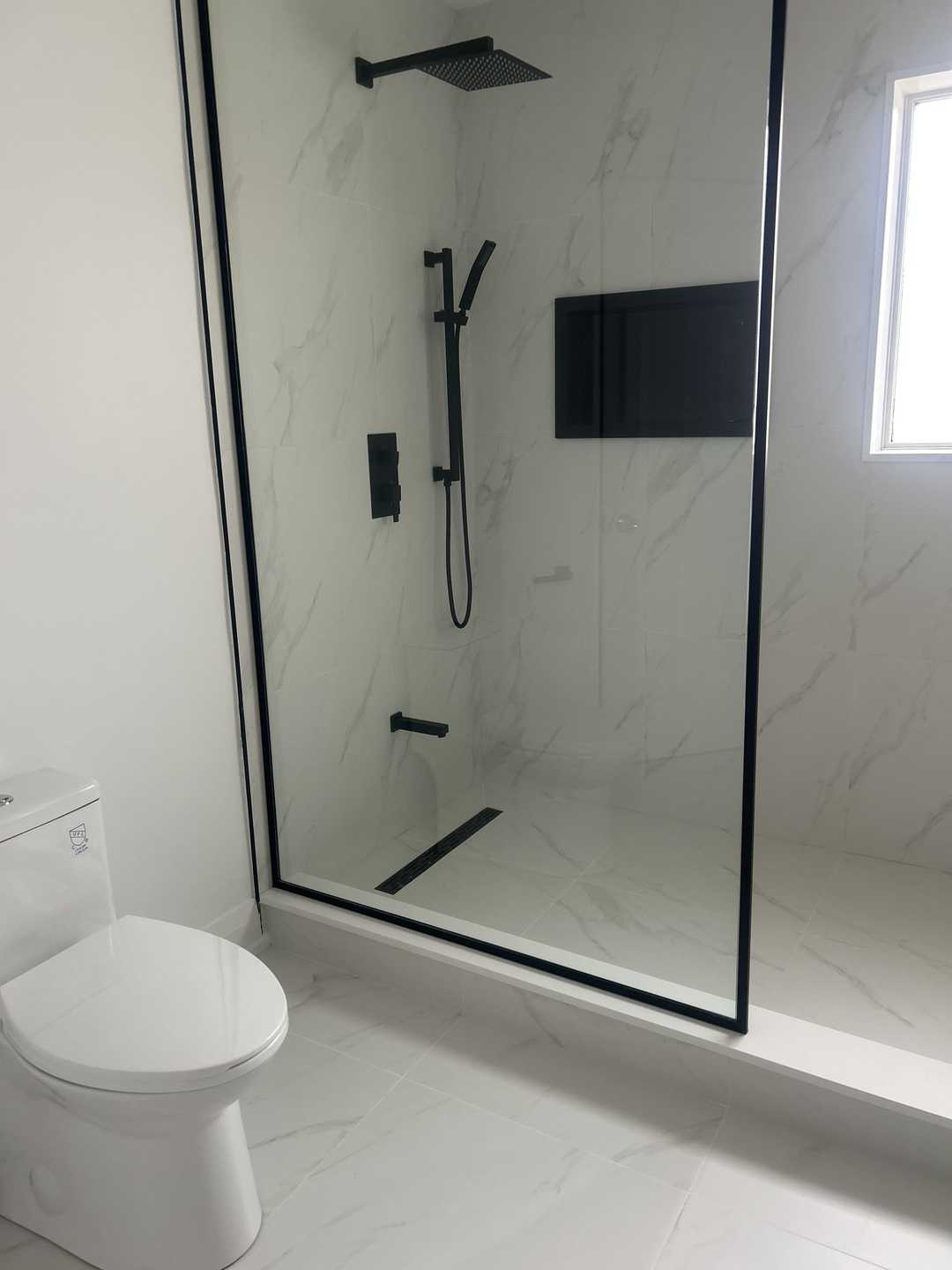 Grey vanity with black kodaen fixture, custom black U-shaped groove