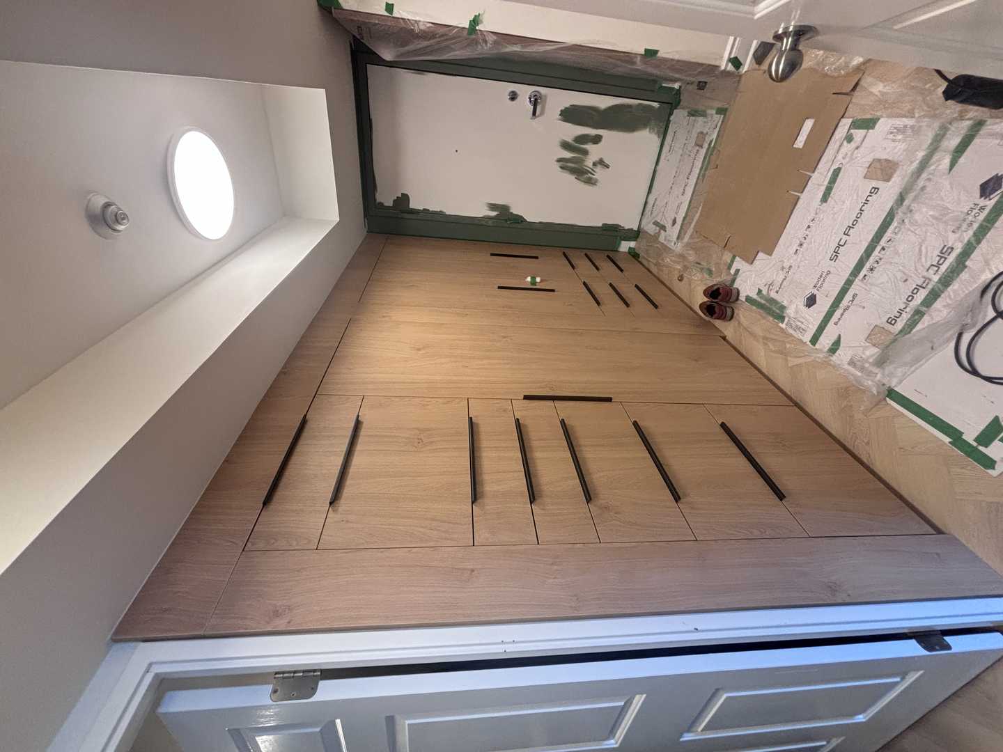 walnut wood panel with navy blue fluted kitchen, herringbone oak