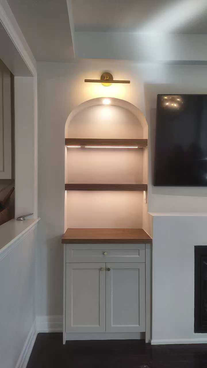 arch fireplace wall unit with shelf and underlight, gold fixture