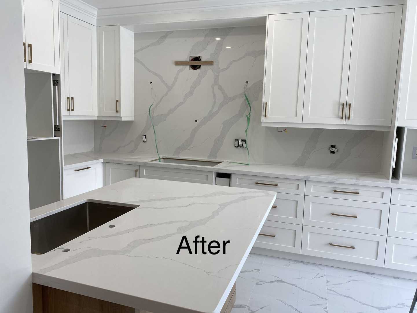 L shaped kitchen- white wood panel cabinet with dark wood