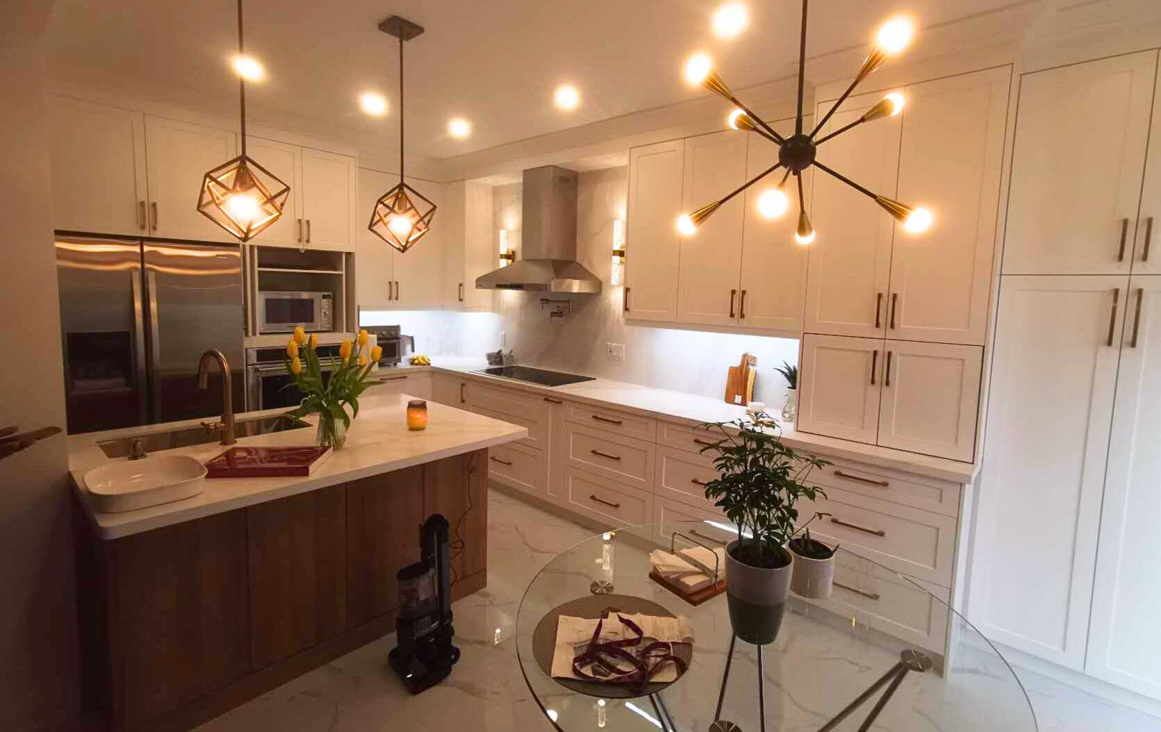 L shaped kitchen- white wood panel cabinet with dark wood