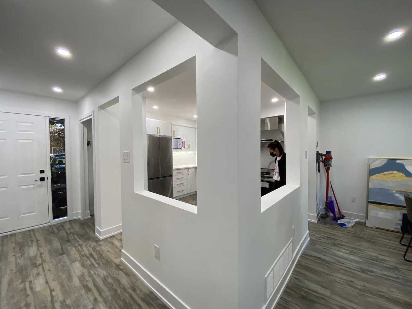 Polished white kitchen cabinets with gold hardware