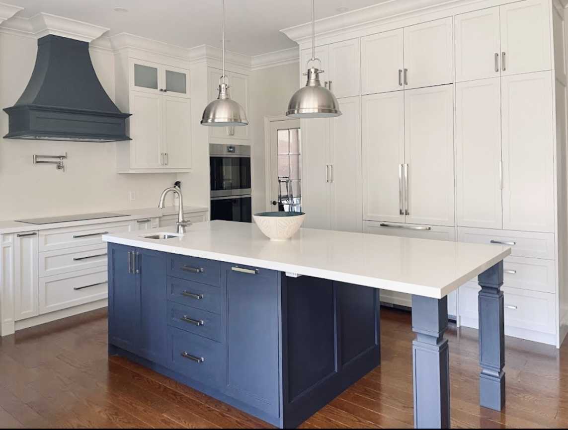 Complete home renovation with a statement wavy-textured fireplace wall. Kitchen