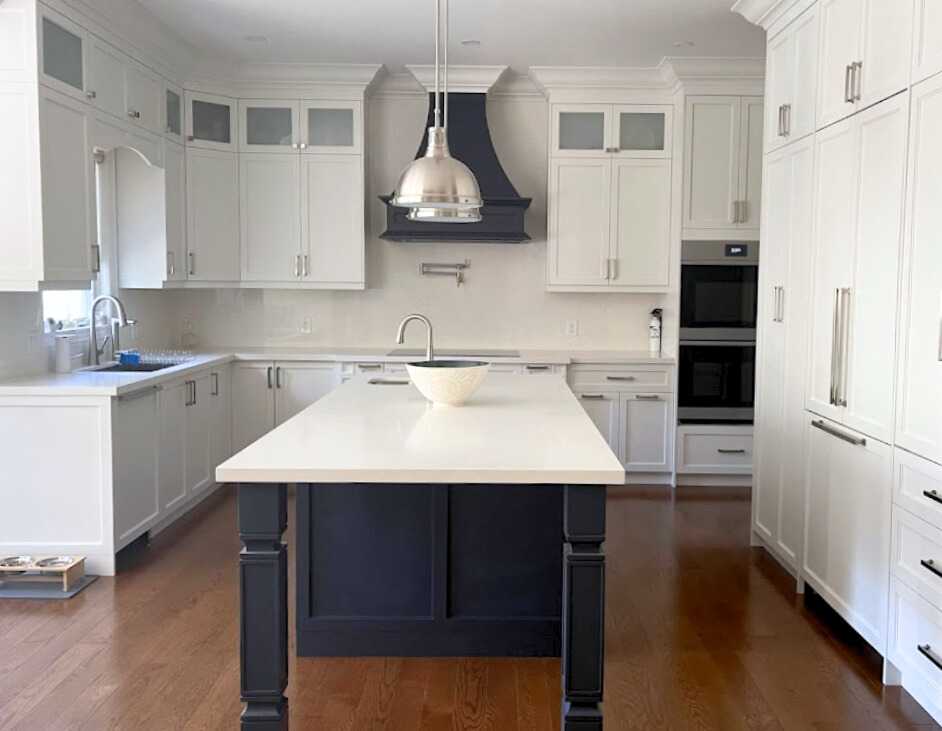 Complete home renovation with a statement wavy-textured fireplace wall. Kitchen
