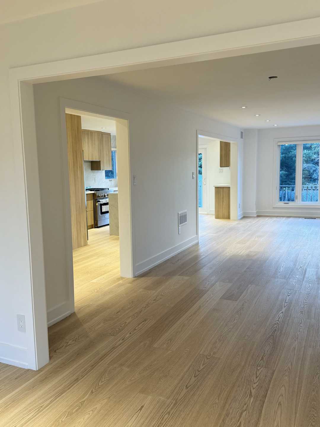 Whole-house floor renovation, including the staircase finished in natural wood