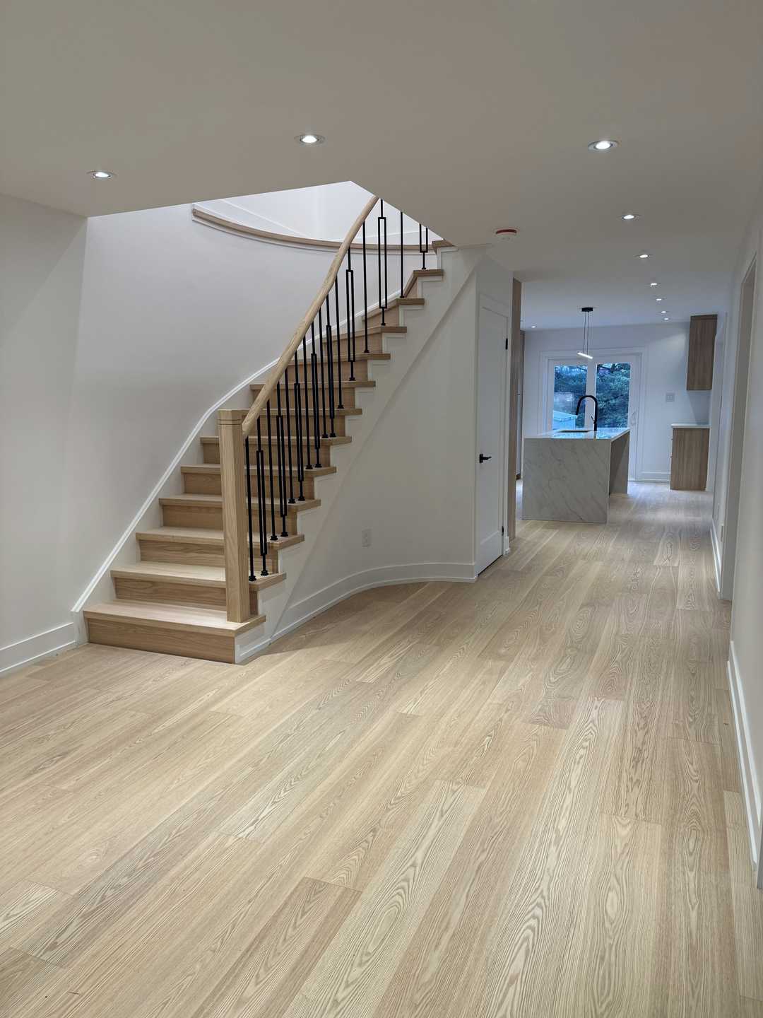 Whole-house floor renovation, including the staircase finished in natural wood