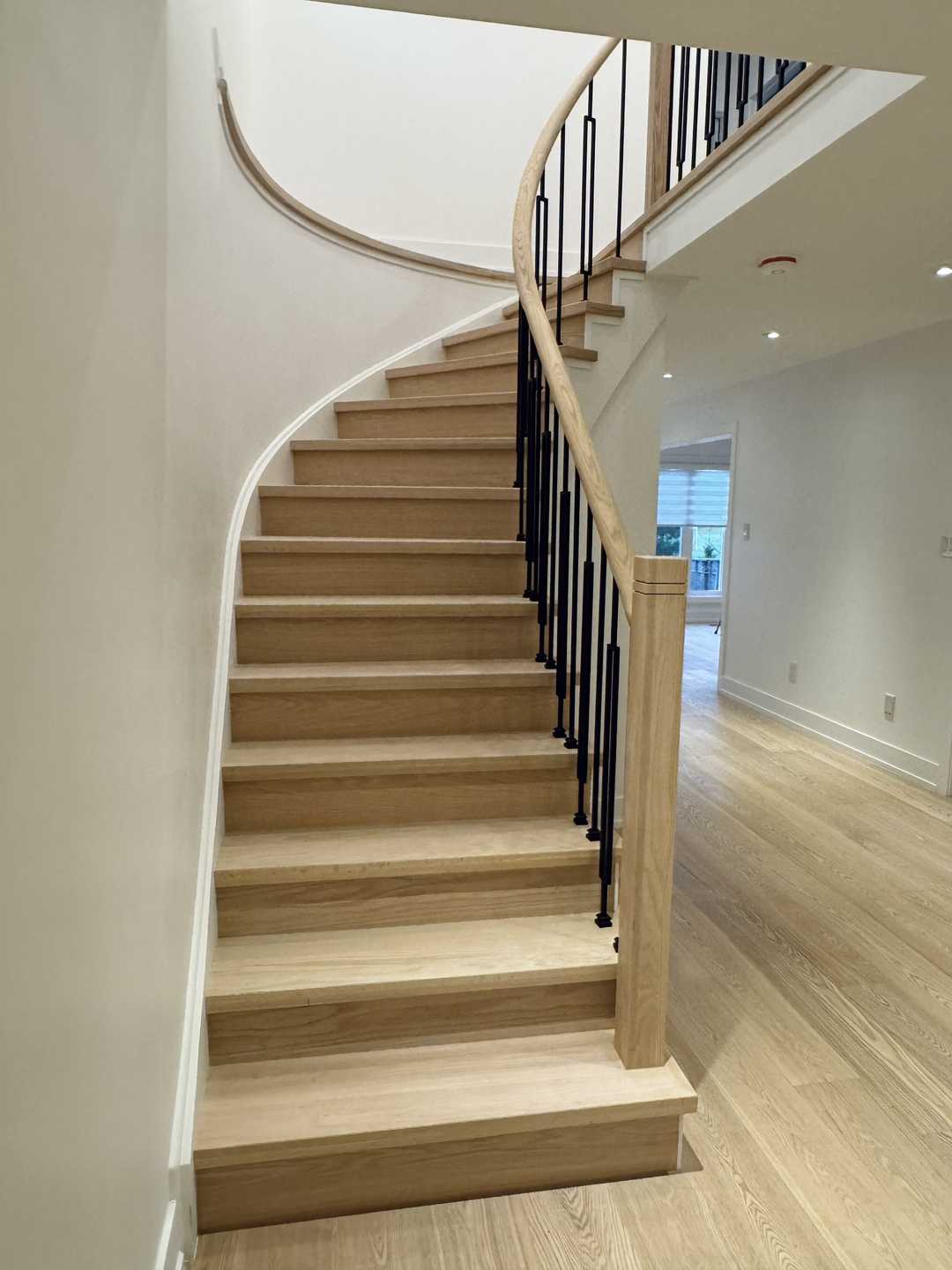 Whole-house floor renovation, including the staircase finished in natural wood