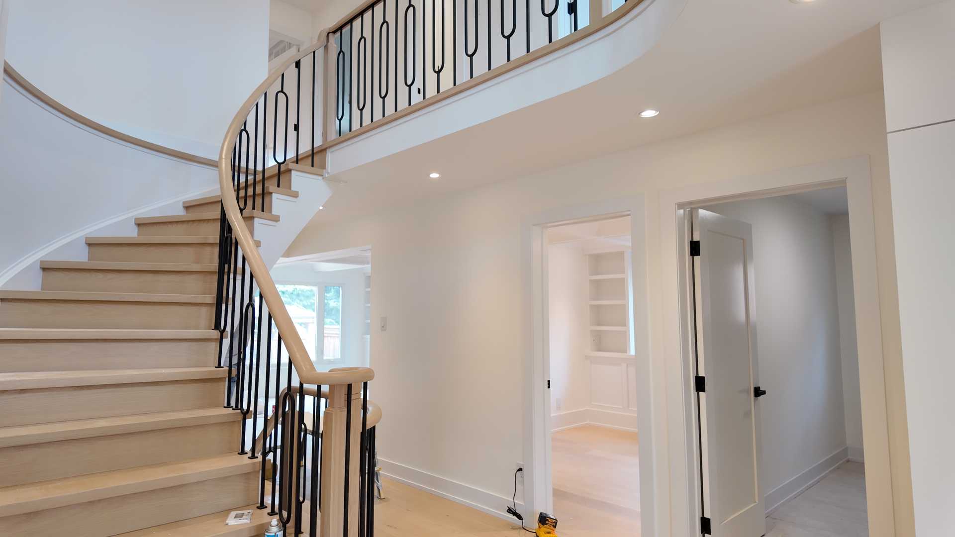 blonde wood flooring, with smooth rounded handrail