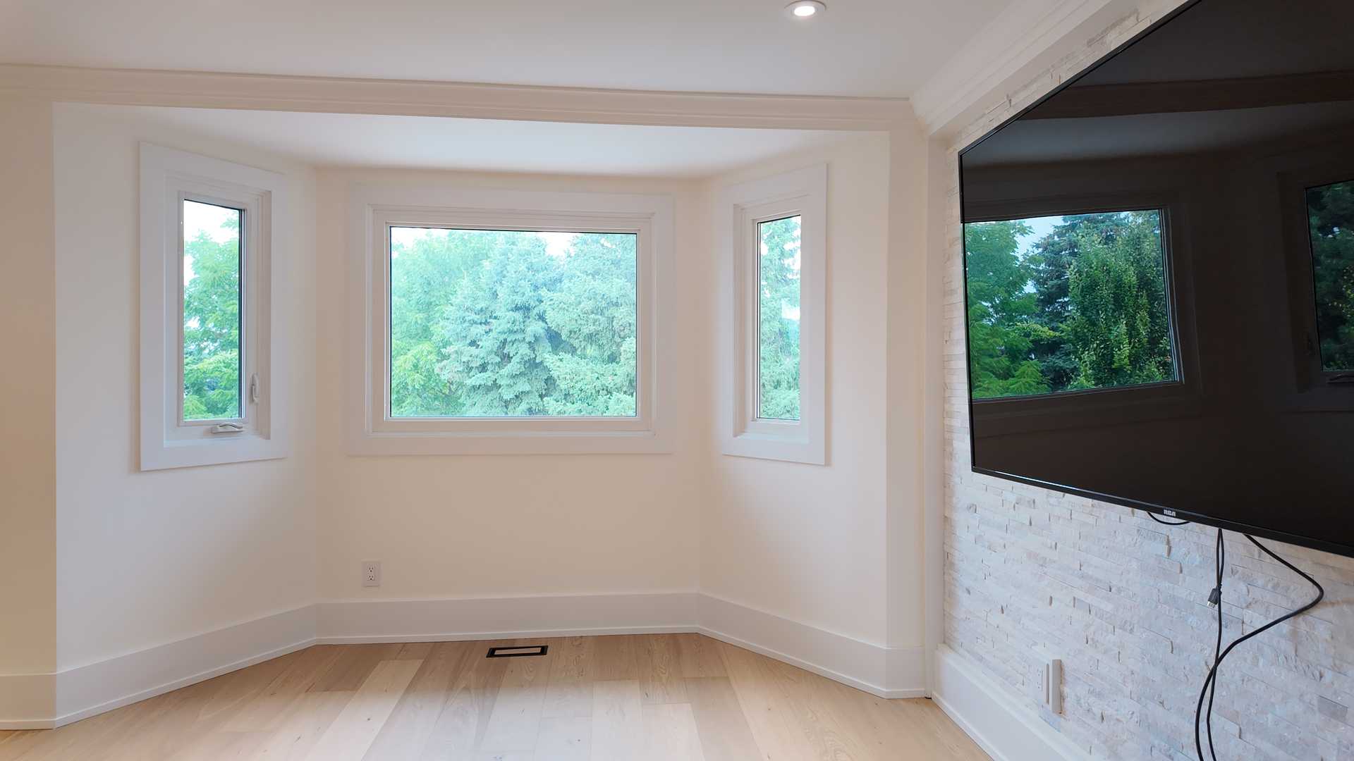 blonde wood flooring, with smooth rounded handrail