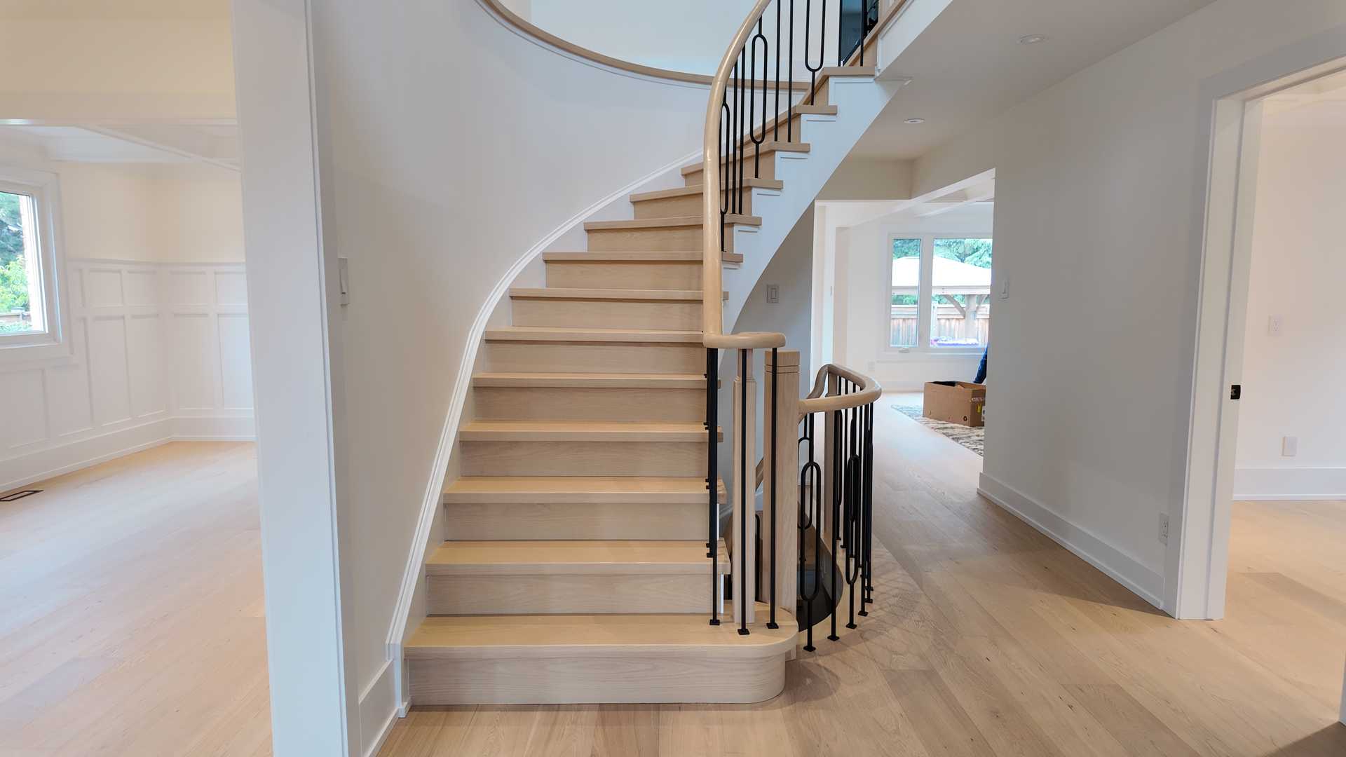 blonde wood flooring, with smooth rounded handrail