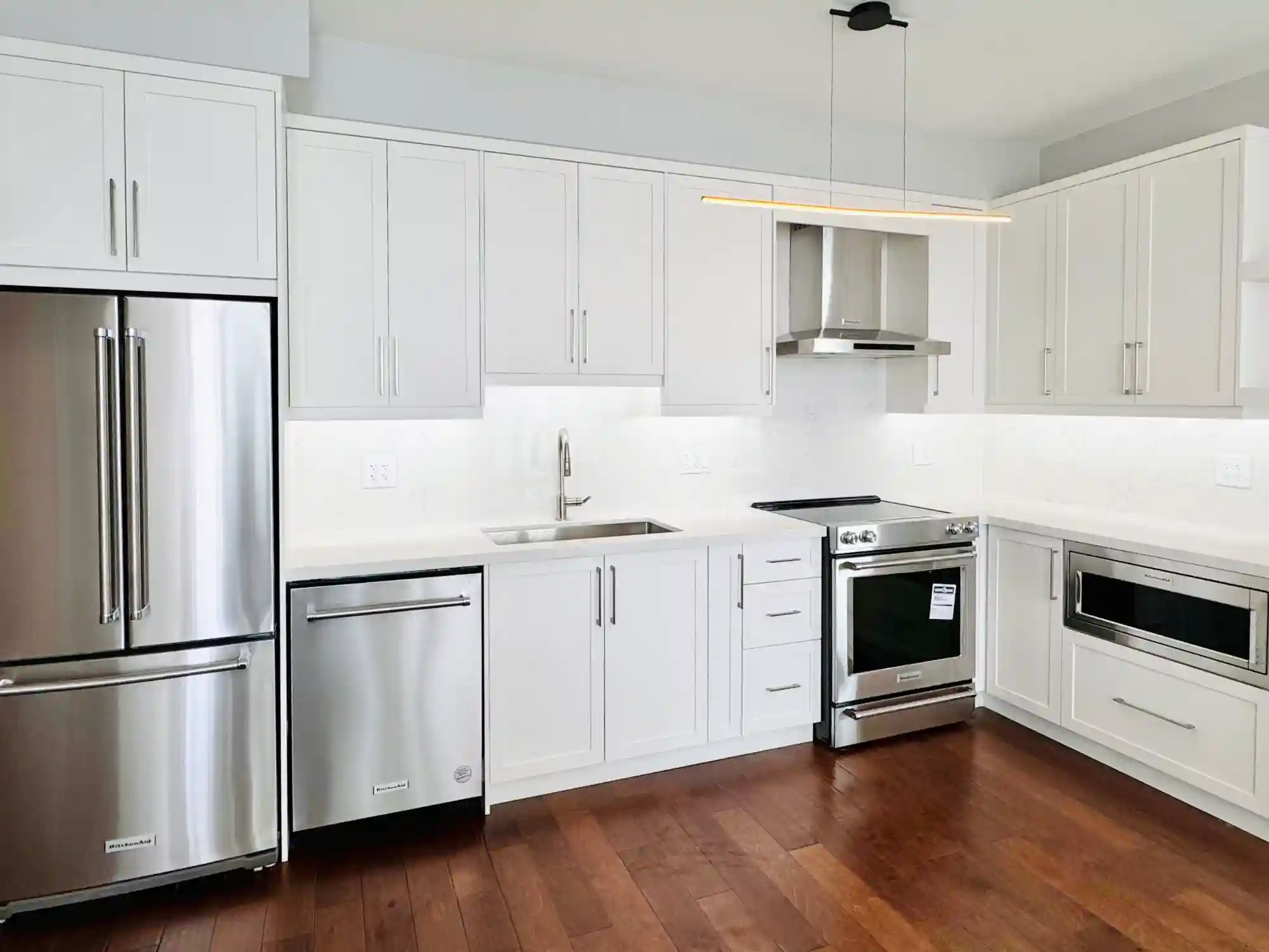 Scarborough condo kitchen renovation with custom cabinet and featured wall